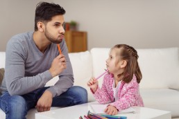 Father daughter thinking about answer to homework question